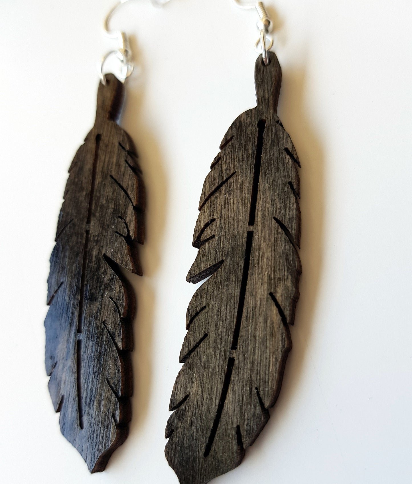 Laser cut wooden earrings feather shape in dark oak, ebony or mahogany