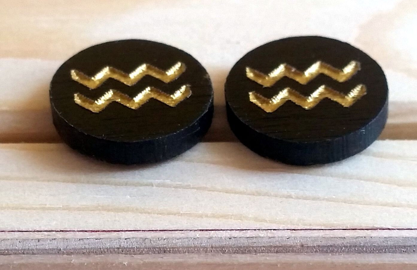 Small wooden stud earrings etched engraved hand painted zodiac signs black and gold. Free postage.