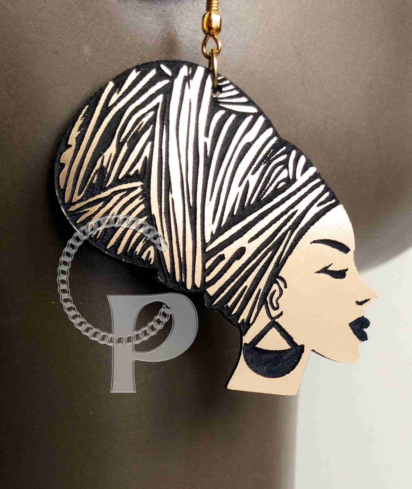 African earrings woman head wrap silhouette metallic look gold and black