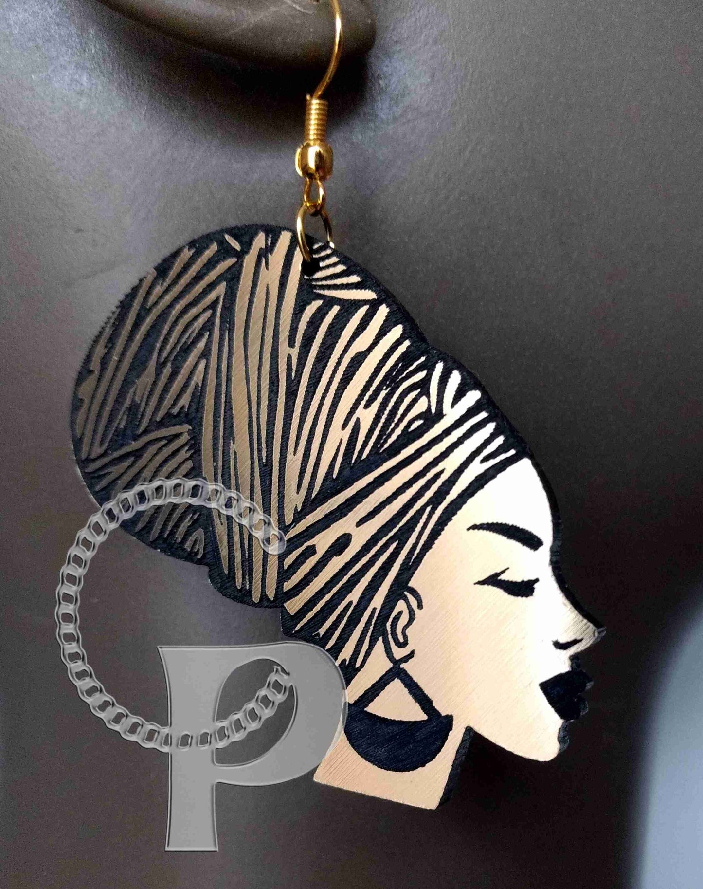 African earrings woman head wrap silhouette metallic look gold and black