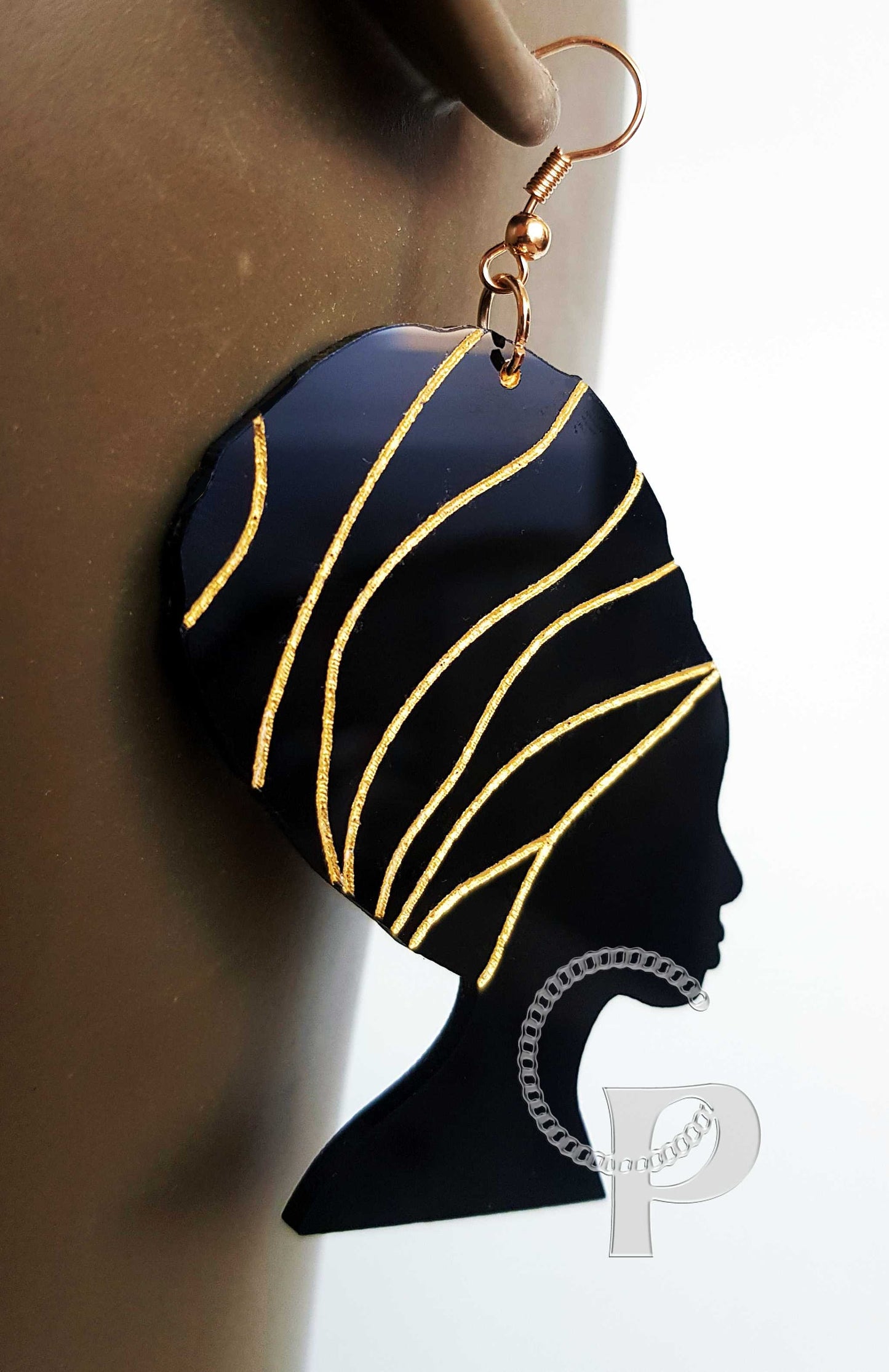 Beautiful laser cut acrylic Afro silhouette earrings in black and gold head wrap