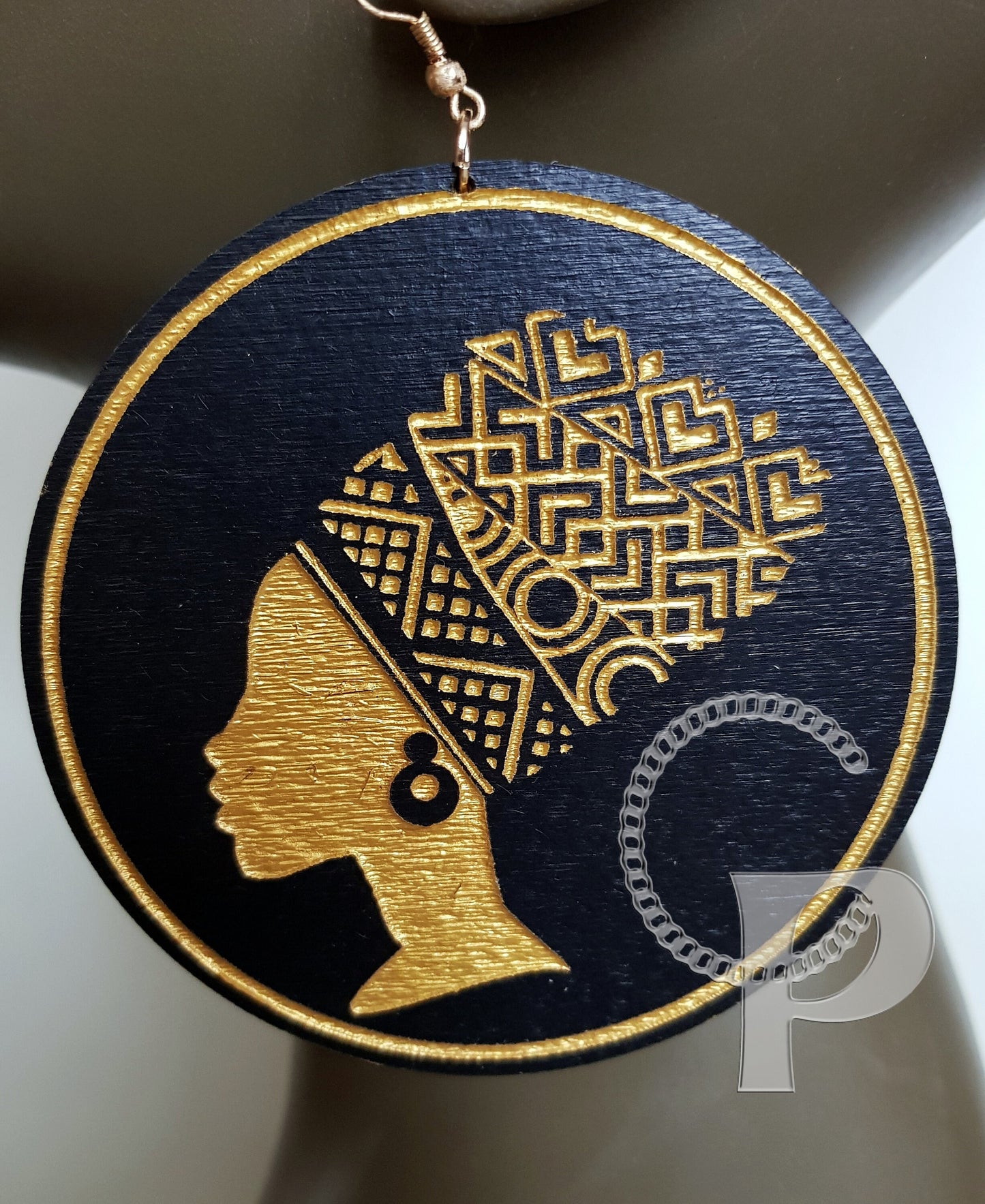 African woman Queen head wrap silhouette wooden engraved circle earrings black and gold